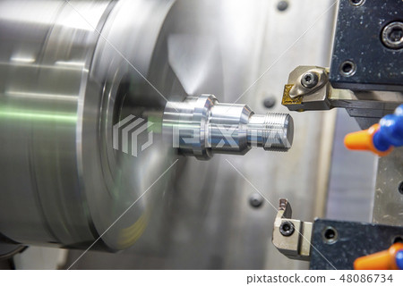 The CNC lathe machine cutting the thread . The CNC lathe machine cutting the thread . 48086734