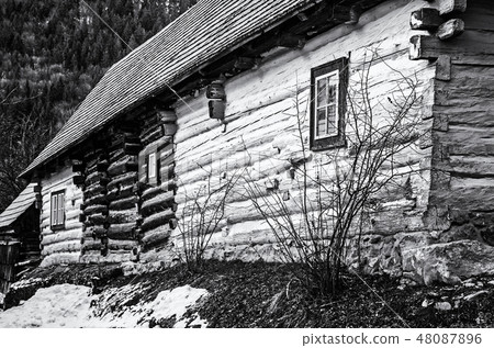Yellow wooden house in Vlkolinec, colorless Yellow wooden house in Vlkolinec, colorless 48087896