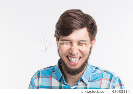 Expression and gesture concept - Close up portrait of laughing man Expression and gesture concept - Close up portrait of laughing man 48088314