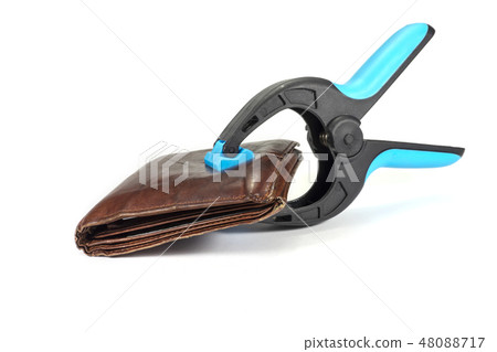 Old leather wallet held by a clasp 48088717