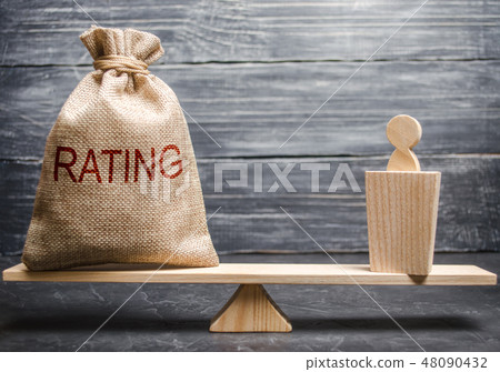 A politician and a bag with a rating on the scales A politician and a bag with a rating on the scales 48090432
