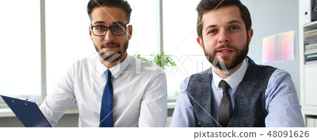 Group of businessmen with financial graph and silver pen Group of businessmen with financial graph and silver pen 48091626