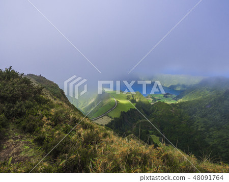 Stunning view on volcanic lakes. Green Lagoa de Santiago and blue Lagoa Azul with Sete Cidades 48091764