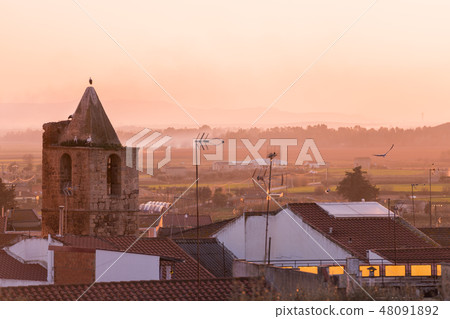Sunset views of the church of Santa Cecilia and the town of Medellin 48091892