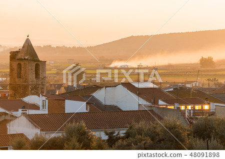 Sunset views of the church of Santa Cecilia and the town of Medellin 48091898
