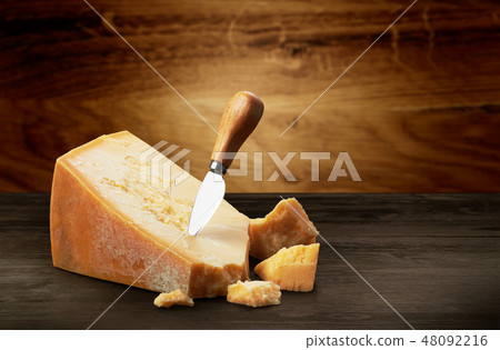 Parmesan cheese on wood 48092216