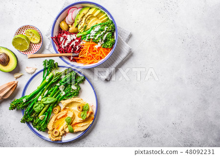 Rainbow vegetable salad and broccolini  48092231