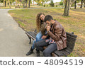 Young couple enjoying the time in the public park 48094519