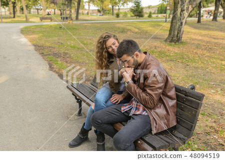 Young couple enjoying the time in the public park 48094519