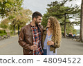 Young couple walking in the city park 48094522