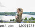 Attractive young woman near the river 48094523