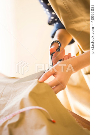 Women's hand at sewing 48095882