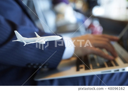 A businessman of a business trip abroad who works at the airport 48096162