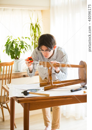 Men enjoying DIY 48096175
