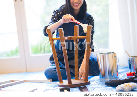 A woman enjoying DIY A woman enjoying DIY 48096232