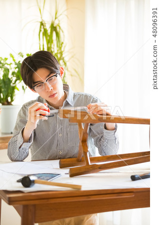 Men enjoying DIY 48096391