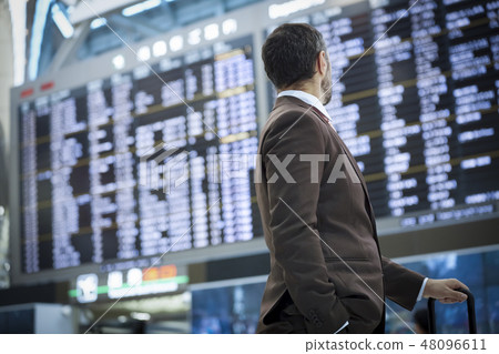 A businessman at a business trip abroad A businessman at a business trip abroad 48096611