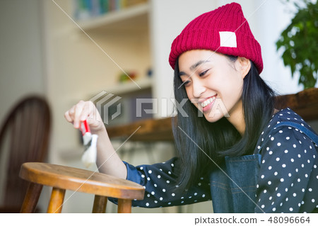 A woman enjoying DIY A woman enjoying DIY 48096664
