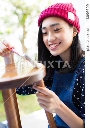A woman enjoying DIY 48096699