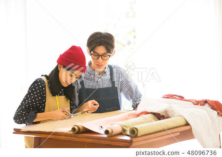 Men and women sewing 48096736