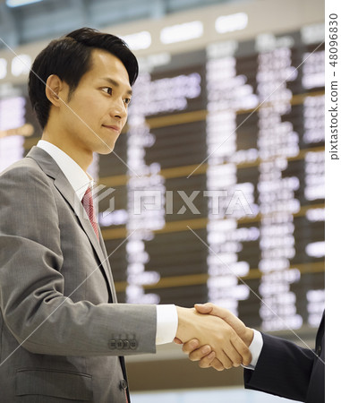 A businessman who will welcome people at the airport A businessman who will welcome people at the airport 48096830