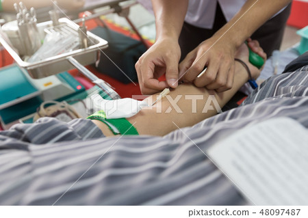 Nurse receiving blood from blood donor in hospital 48097487