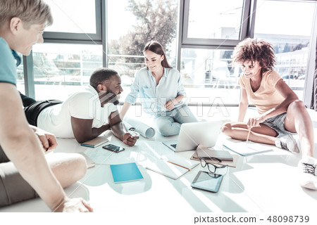 Relaxed young colleagues having pause 48098739