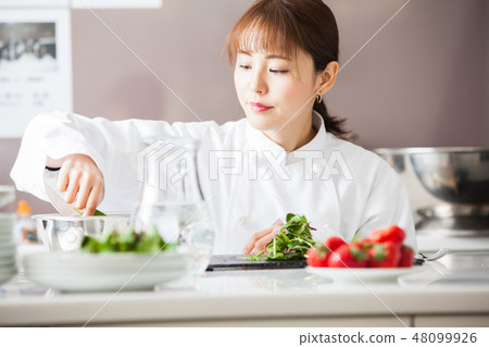 Cooking woman cooking chef Cooking woman cooking chef 48099926