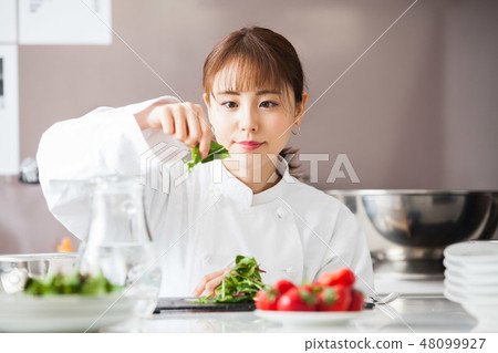 Cooking woman cooking chef Cooking woman cooking chef 48099927