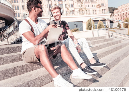 Positive delighted foreigner drinking coffee 48100676