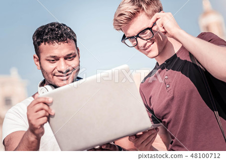 Concentrated student looking at screen of computer 48100712