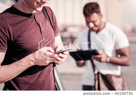 Close up of male hands that holding telephone 48100730