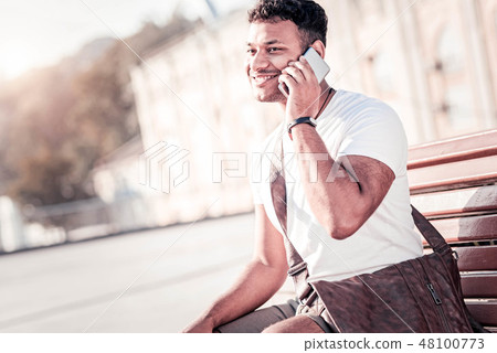 Positive brunette having telephone conversation 48100773