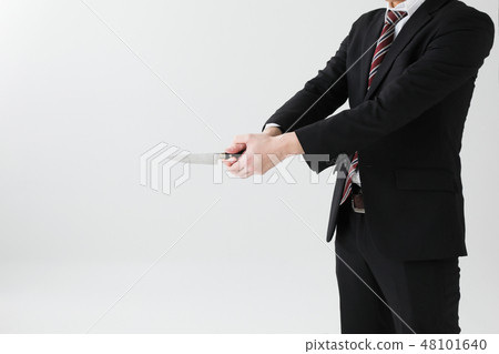 A suit male has a kitchen knife with white background 48101640