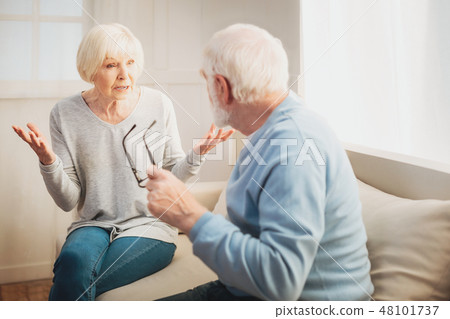 Loving pensioners arguing about their new future garden 48101737