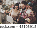 Young girl chooses bouquet option on laptop 48103918