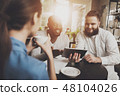 Multiethnic company people is working on project 48104026