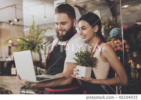 Portrait of smiling florists man and woman Portrait of smiling florists man and woman 48104035