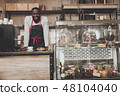 Smiling afro american barista male at work 48104040