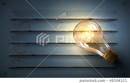Light bulb on metal surface 48104121
