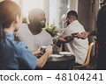 Young African American is calculated credit card 48104241