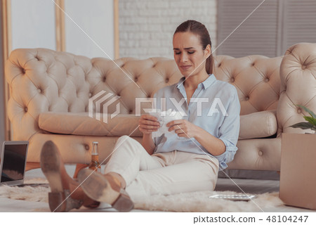 Full length of annoyed woman tearing documents Full length of annoyed woman tearing documents 48104247
