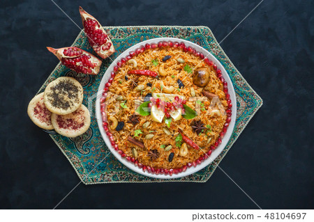 Vegetarian dish on a black table. Top view.  48104697