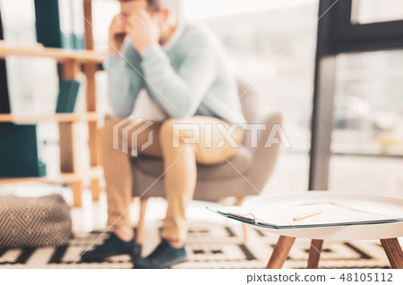 Office worker feeling bothered after staff meeting Office worker feeling bothered after staff meeting 48105112