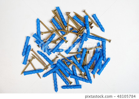Plastic dowel pin or wall plugs on white background Plastic dowel pin or wall plugs on white background 48105784
