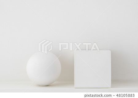 Plaster geometric shapes, sphere and cube on a white background. Plaster geometric shapes, sphere and cube on a white background. 48105883