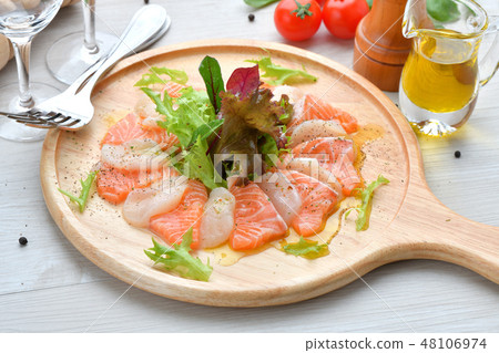 Italian cuisine, salmon and scallop carpaccio, seafood appetizer, hors d'oeuvres, sashimi, Italian cuisine. 48106974