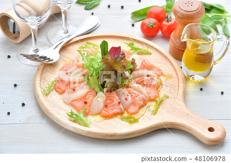 Italian cuisine, salmon and scallop carpaccio, seafood appetizer, hors d'oeuvres, sashimi, Italian cuisine. 48106978