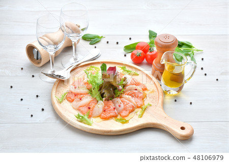 Italian cuisine, salmon and scallop carpaccio, seafood appetizer, hors d'oeuvres, sashimi, Italian cuisine. Italian cuisine, salmon and scallop carpaccio, seafood appetizer, hors d'oeuvres, sashimi, Italian cuisine. 48106979