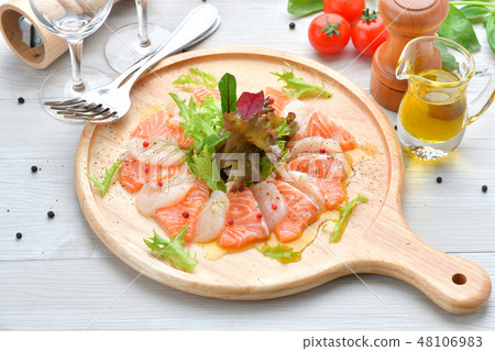 Italian cuisine, salmon and scallop carpaccio, seafood appetizer, hors d'oeuvres, sashimi, Italian cuisine. 48106983